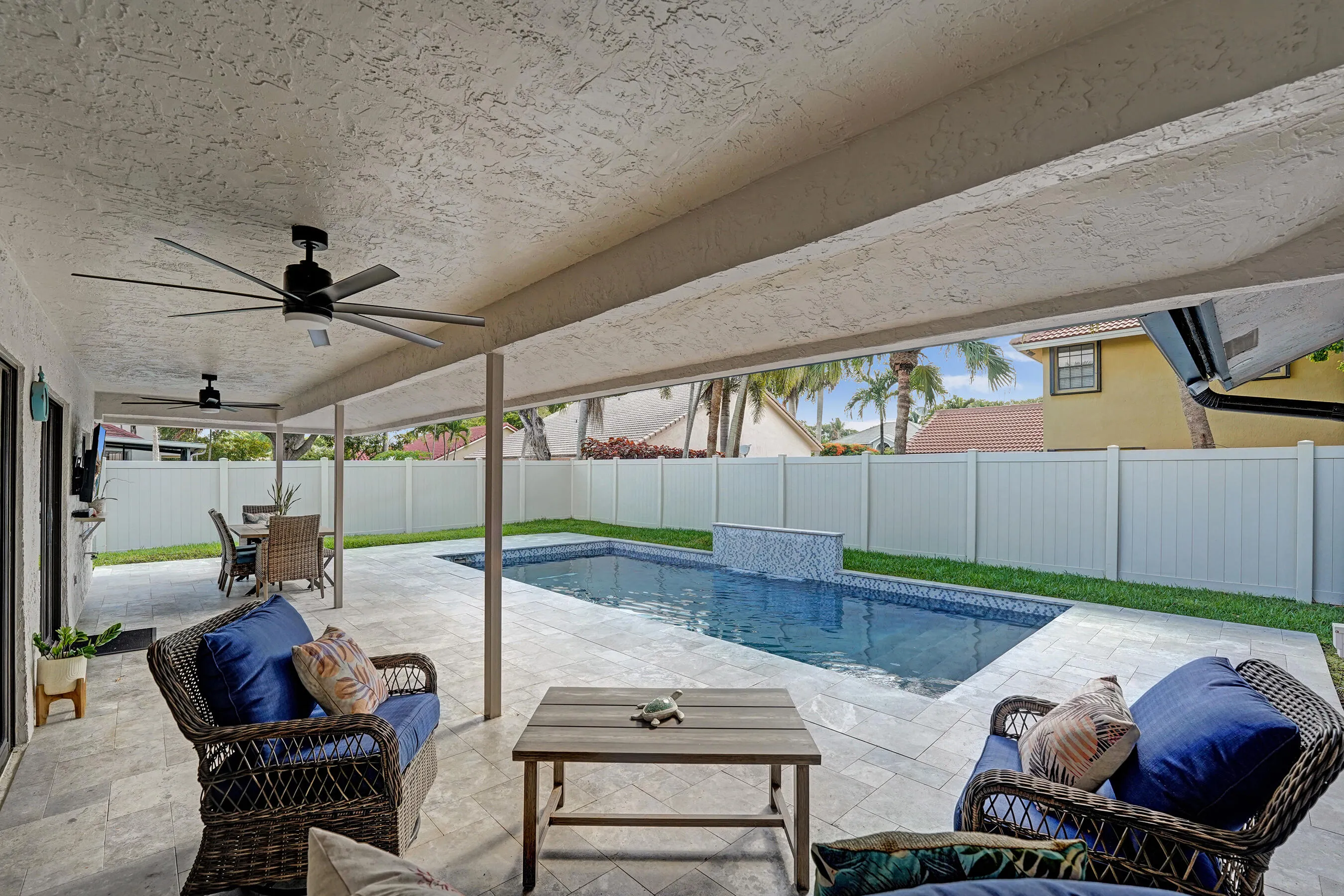Covered patio with large travertine deck