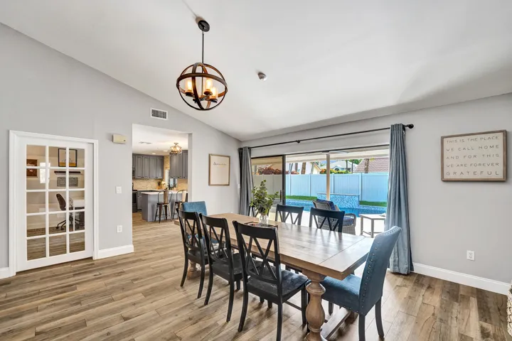 Dining room with triple seamless sliding pocket glass doors