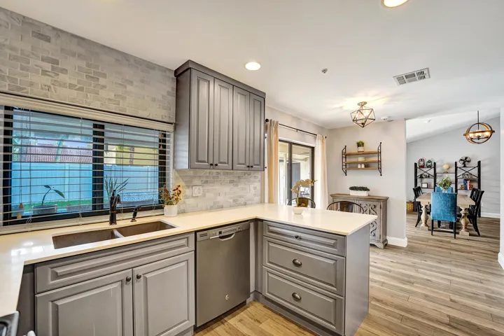 Kitchen with impact window, overlooks pool and patio