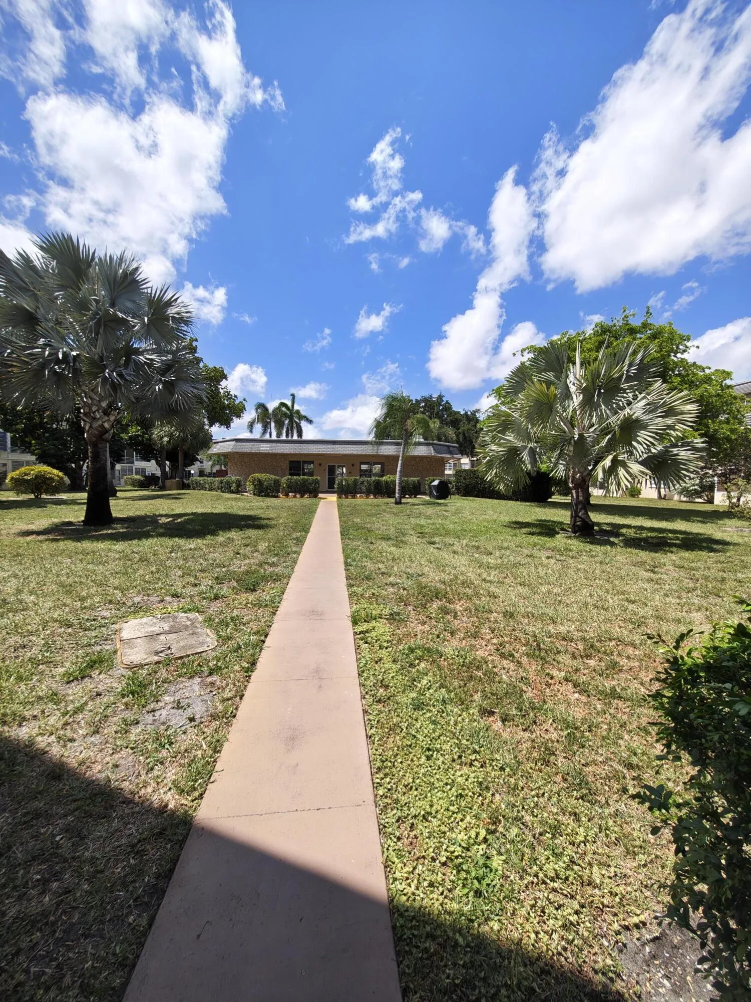 Walkway steps from front door to clubhouse/pool/game room