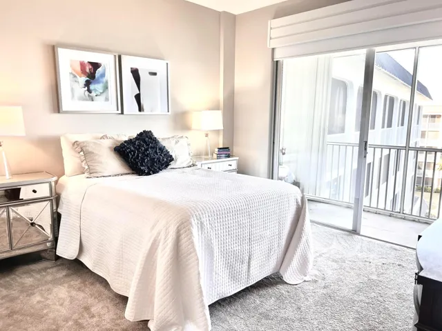 Primary bedroom boasts views of the intracoastal and pool