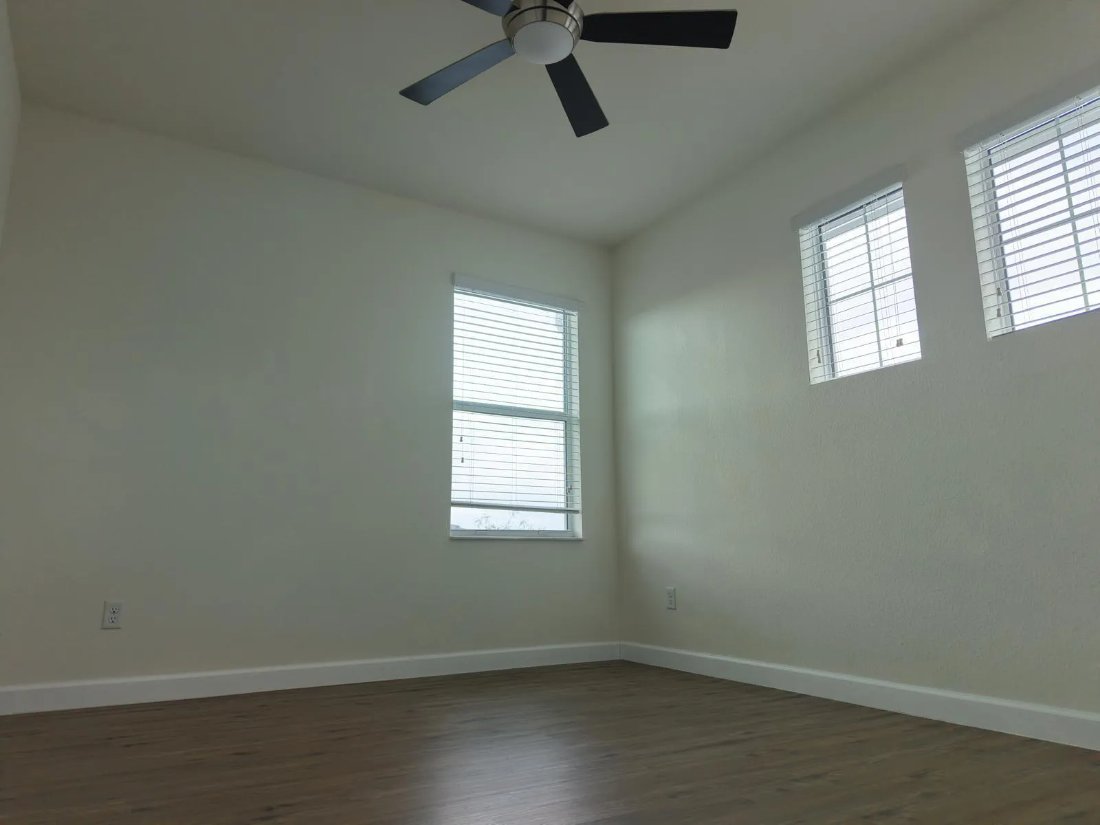 corner bedroom wood floors