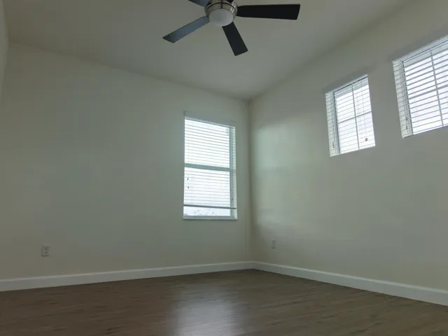 corner bedroom wood floors