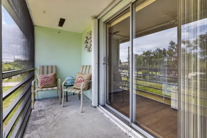 Sliders to outside and bedroom have storm shutters
