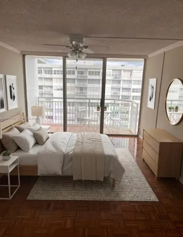 Master Bedroom w/ balcony, en suite bathroom, and two walk-in closets - virtually staged