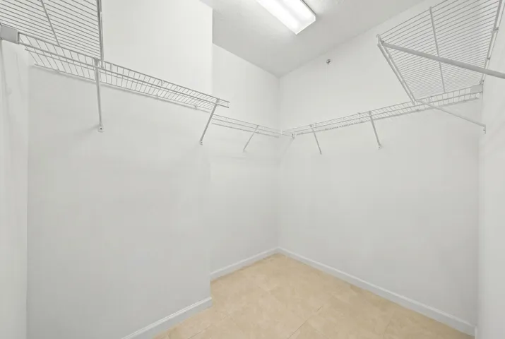 Walk-in closet - primary​​‌​​​​‌​​‌‌​‌‌​​​‌‌​‌​‌​‌​​​‌​​ bedroom
