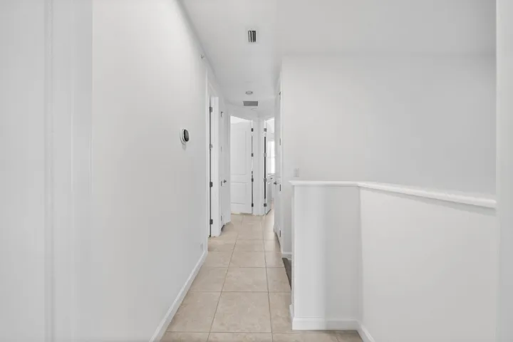 Hallway on 3rd level towards the 2 bedroom and laundry room.