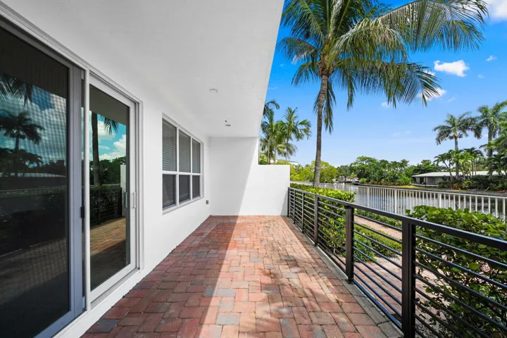 Patio on ground level, access to riverwalk.