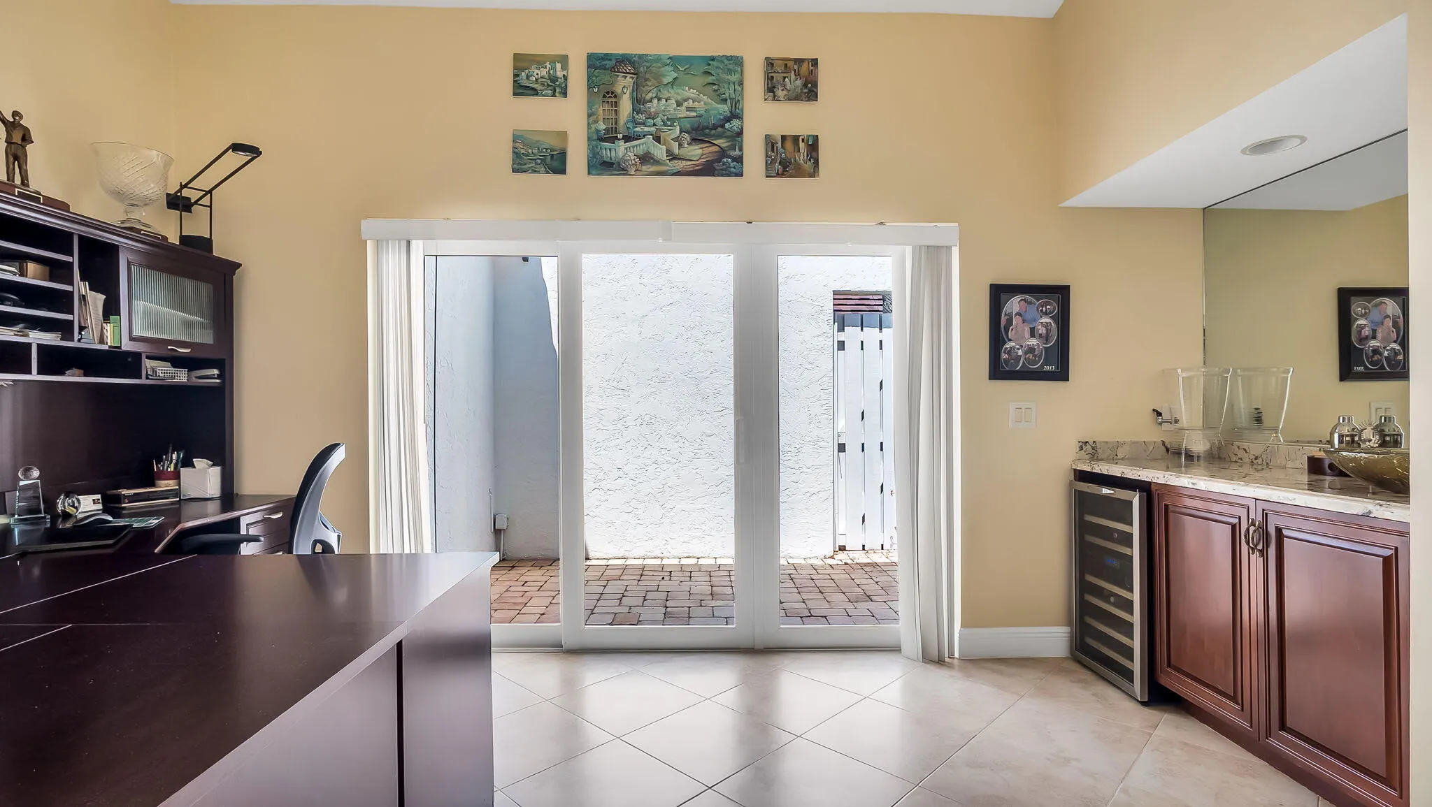 Office/Den with Wet Bar and Patio Area