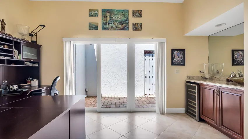 Office/Den with Wet Bar and Patio Area