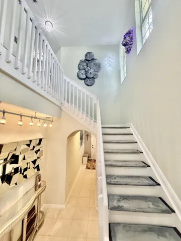 Stairway with Wood Flooring and Removable Carpet.