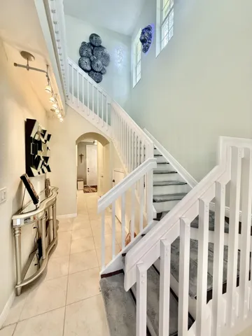 Stairway with Wood Flooring and Removable Carpet.