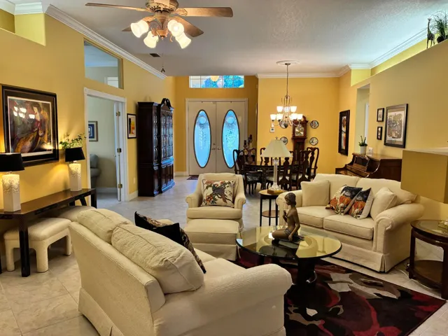 White sofas and chair offered for sale with house