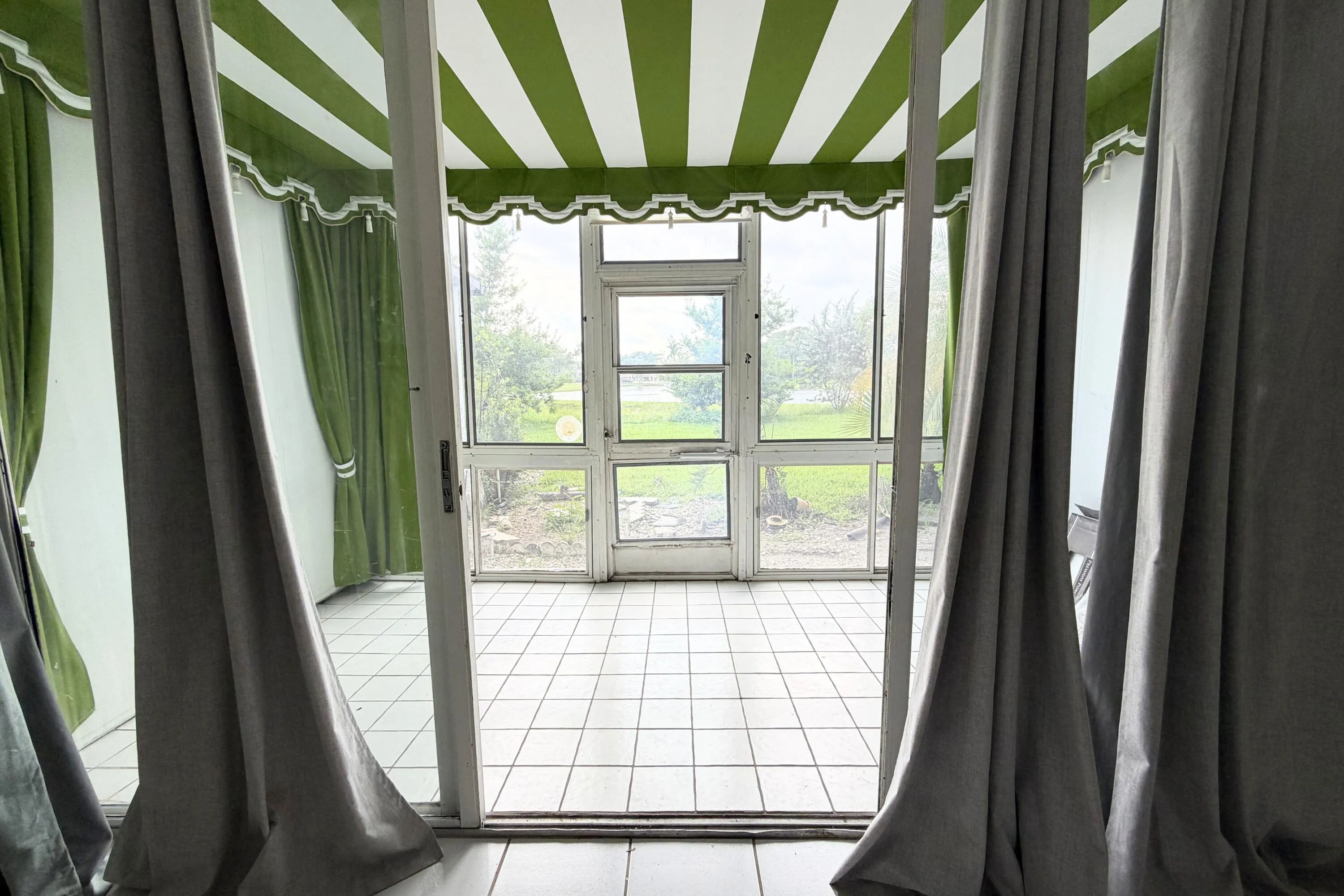 Screened patio, outside door, lake view.