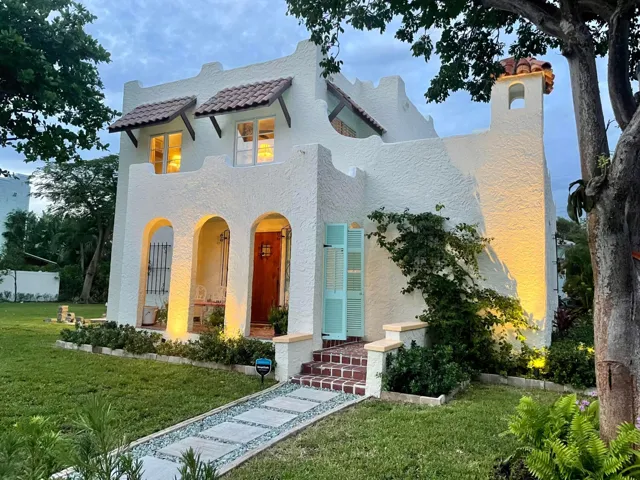 Facade with landscape lighting