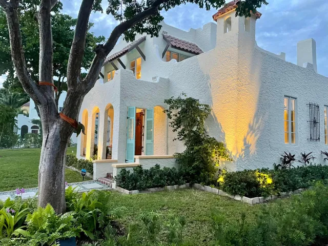 Facade with landscape lighting