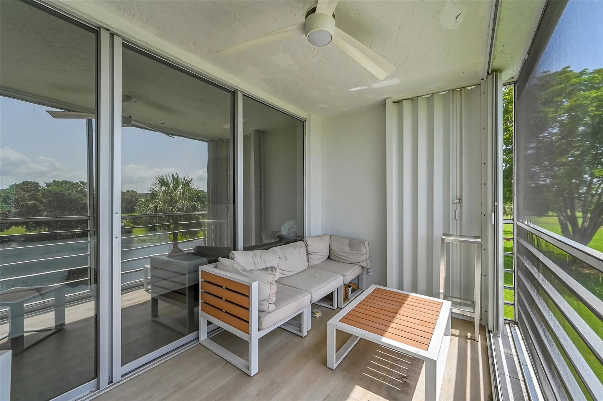 screened and furnished balcony overlooking golf course
