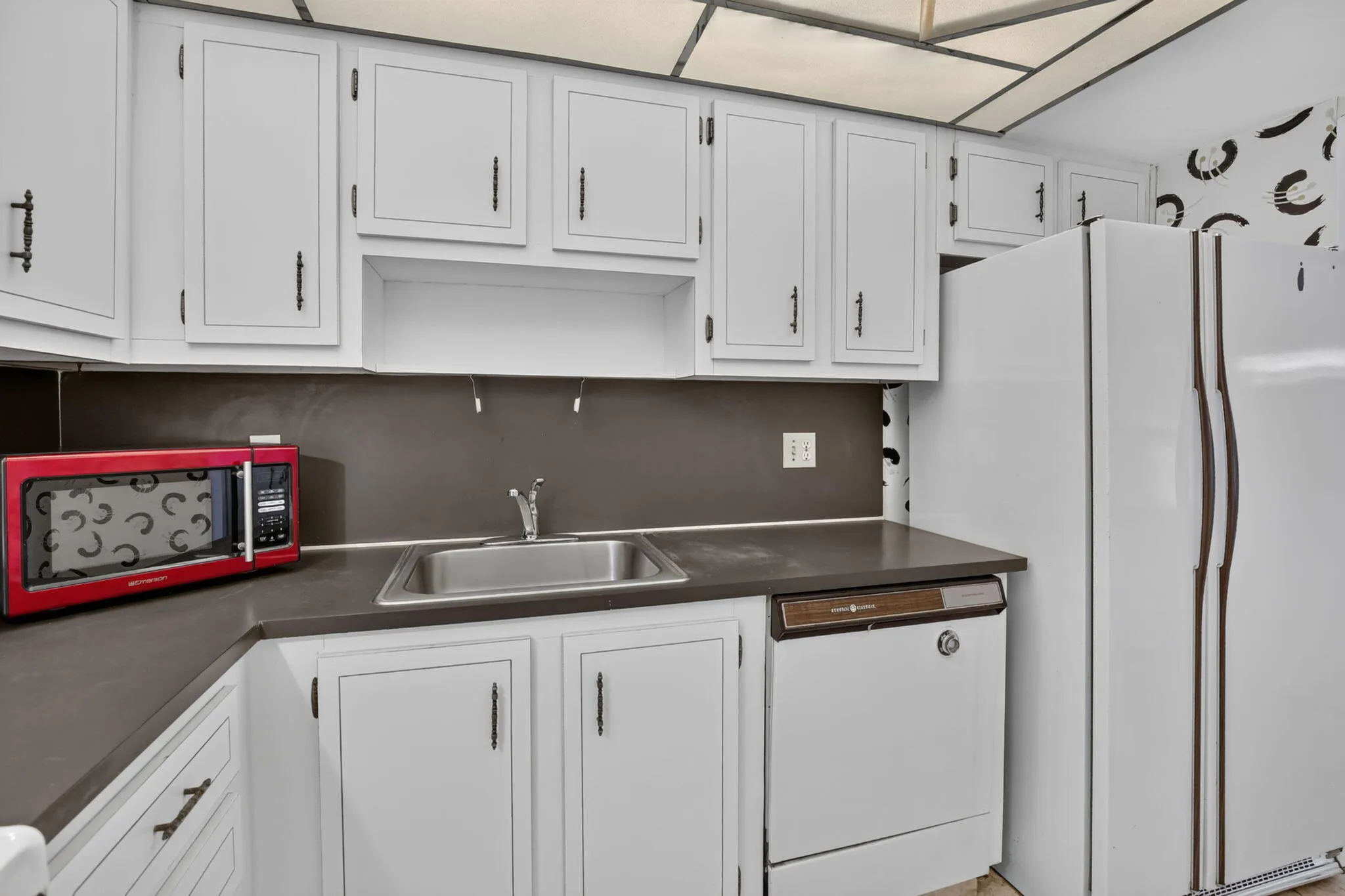 Large kitchen area with plenty of space to be creative with a redesign!