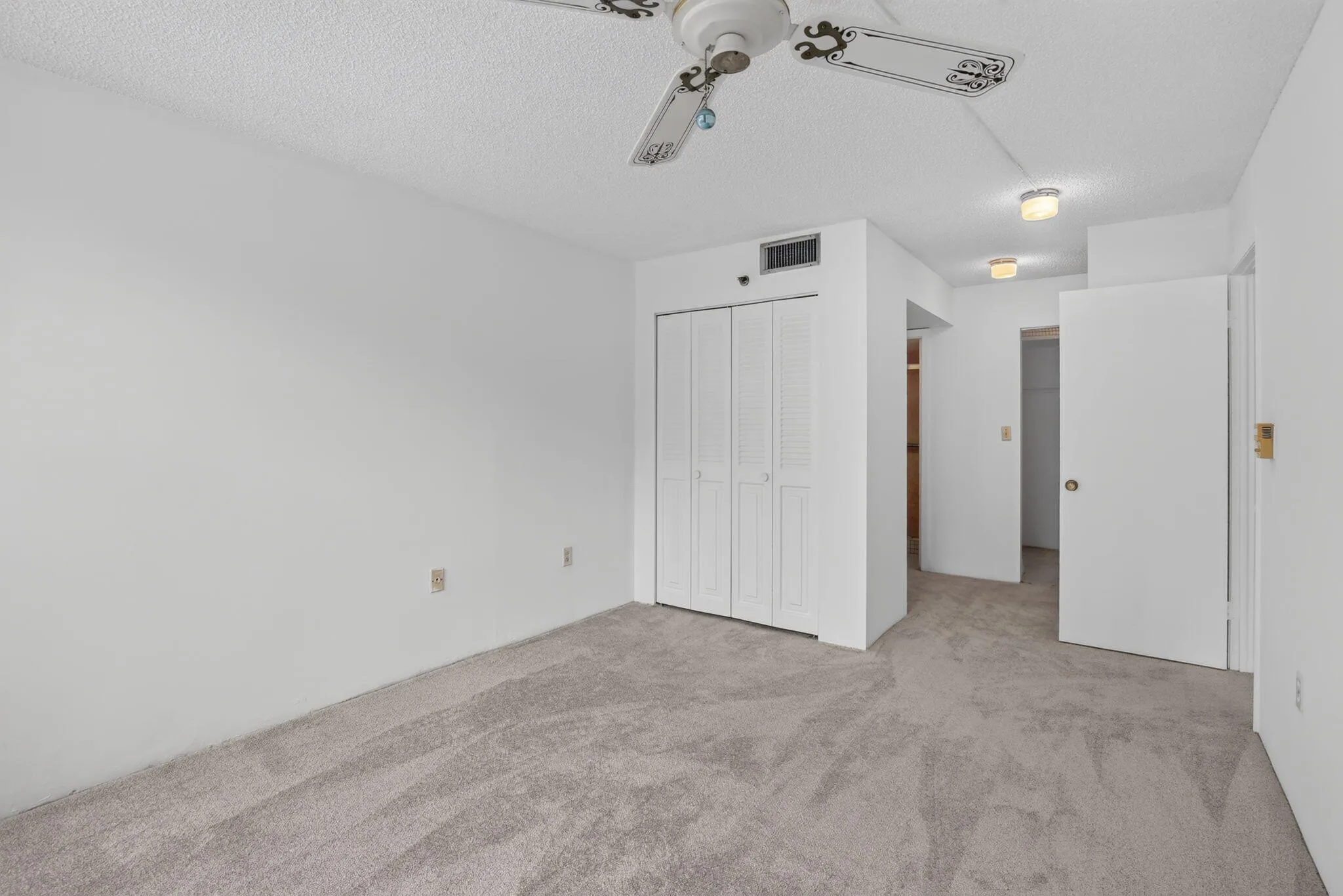 Large, primary suite featuring a walk-in closet, (2) standard closets and full bathroom with standing shower!