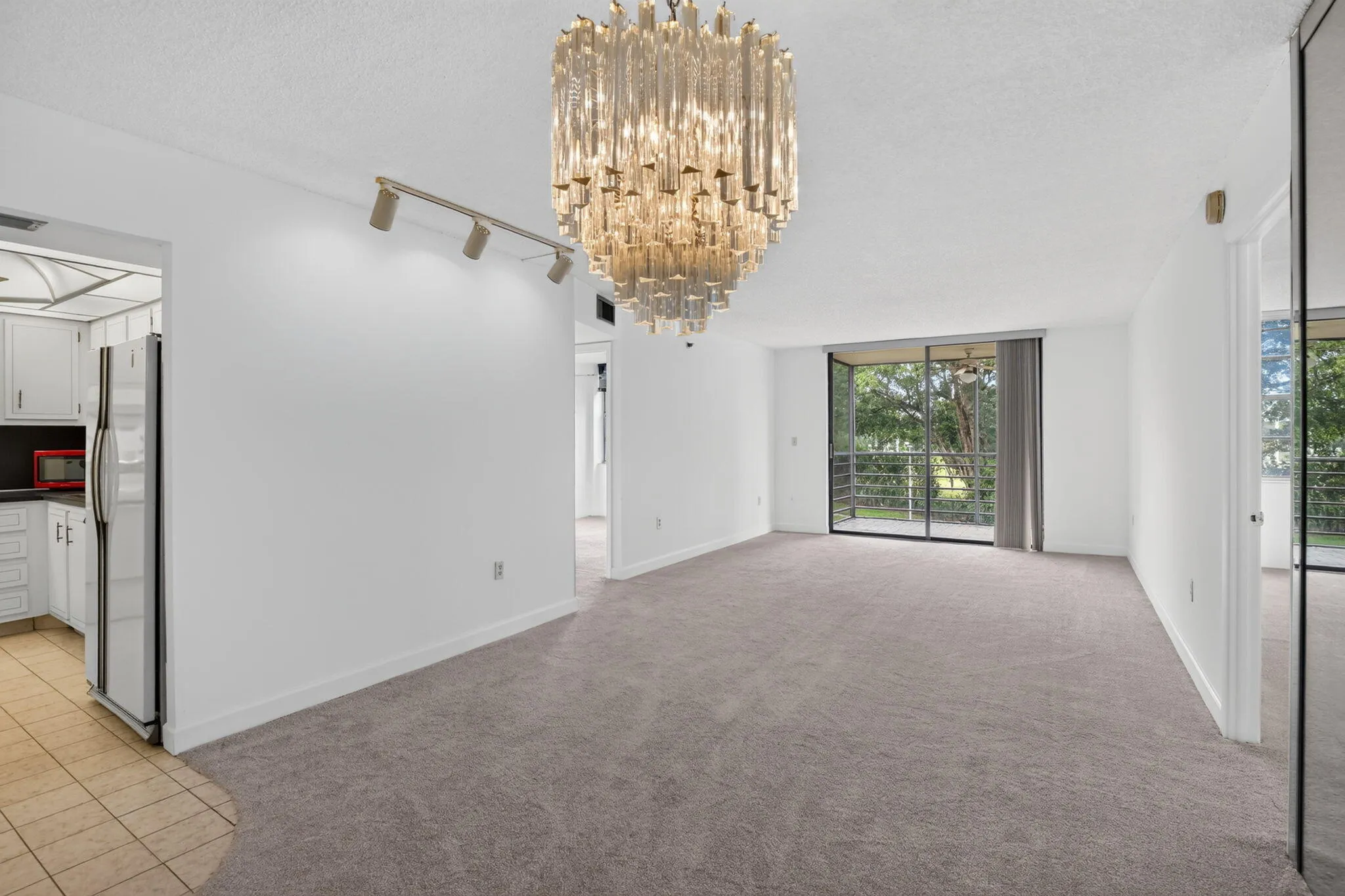 Elongated living room, dining room space with tons of options for furnishings!