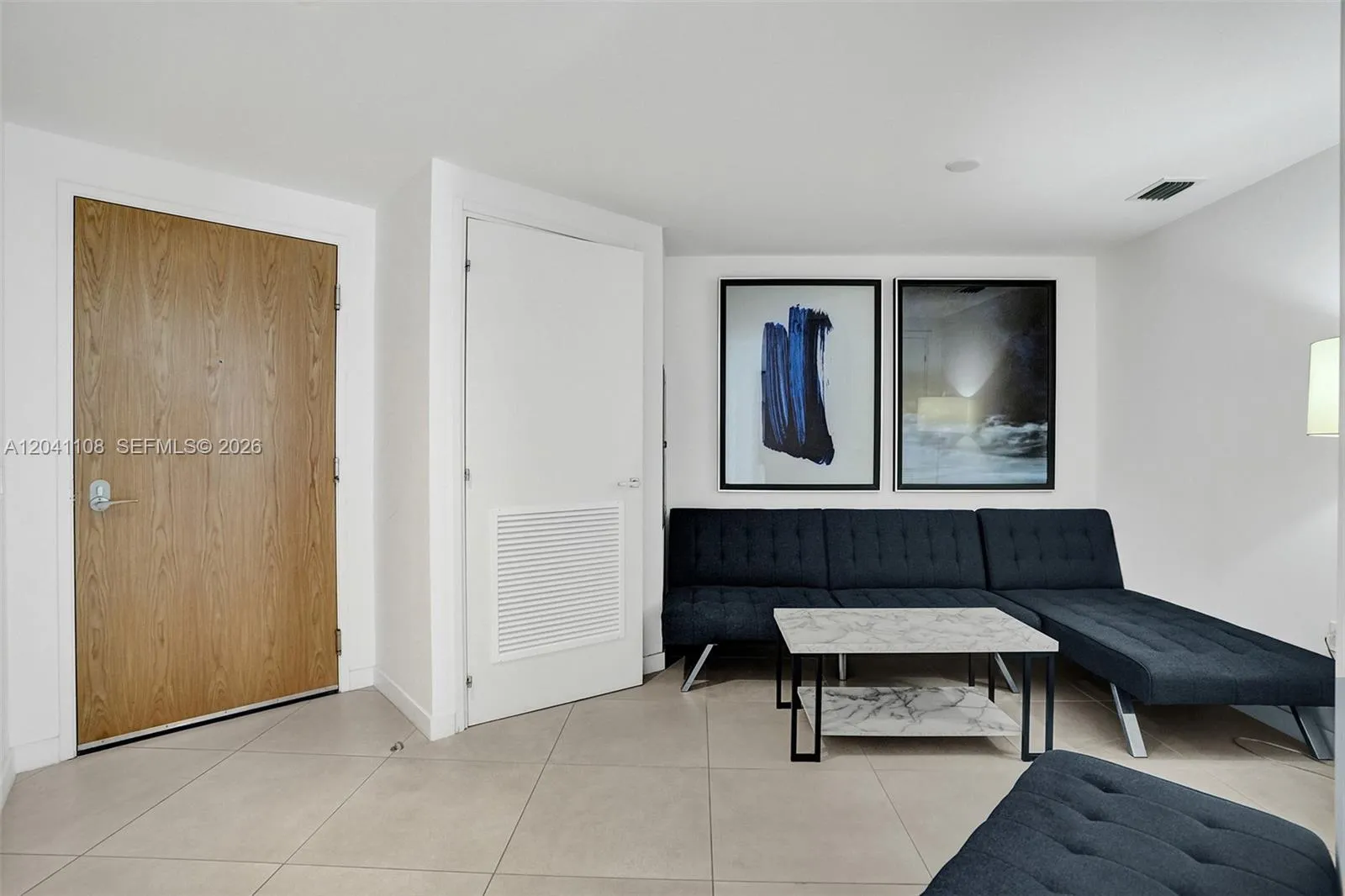 With sofa bed. Washer and dryer in the closet pictured