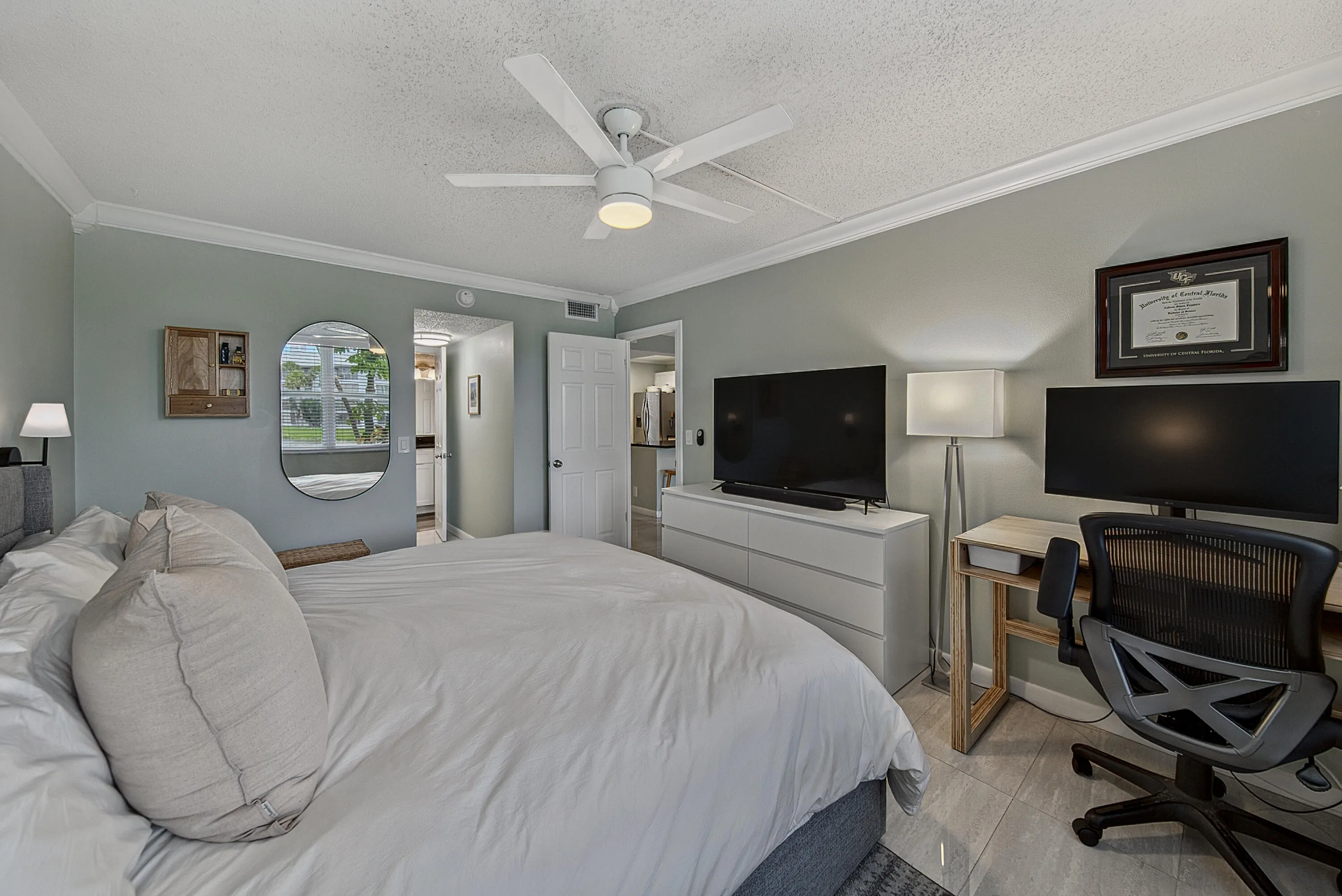 Large primary easily accommodates king size bed