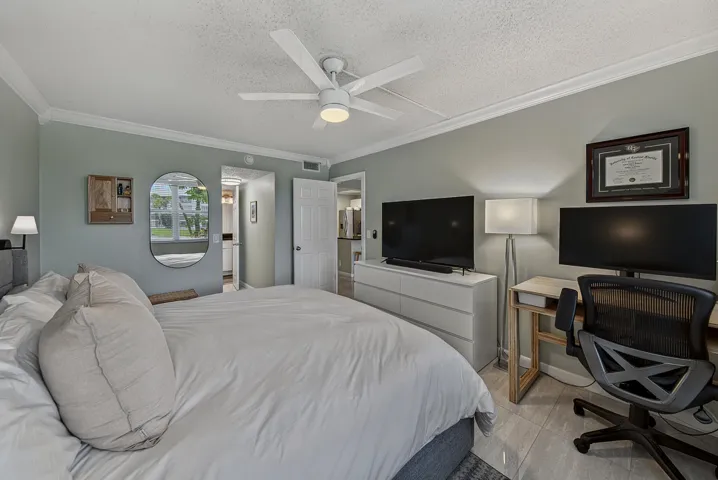 Large primary easily accommodates king size bed