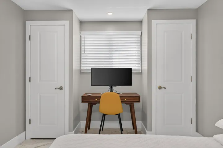 4th Bedroom/Studio that could be perfect for home office, studio rental, craft room, etc...with a small kitchenette, second set of washer/dryer, connected bathroom, mini split AC, and exterior door.