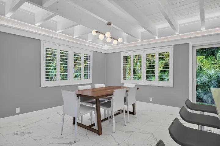 Spacious open kitchen and dining area that looks out over the backyard and patio.