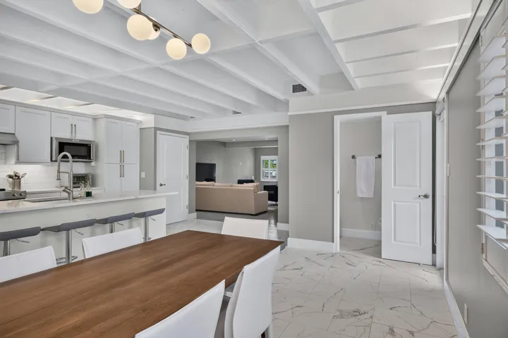 Spacious open kitchen and dining area with a half bathroom.