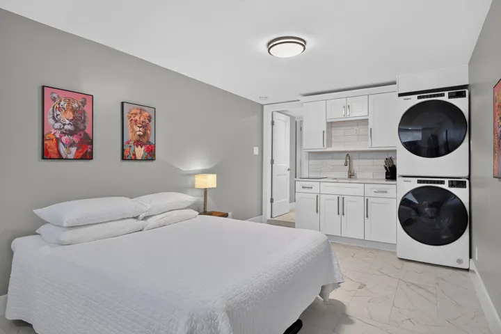 4th Bedroom/Studio that could be perfect for home office, studio rental, craft room, etc...with a small kitchenette, second set of washer/dryer, connected bathroom, mini split AC, and exterior door.