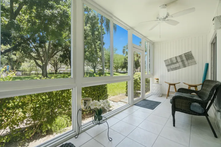 peaceful enclosed patio overlooking pool and trees