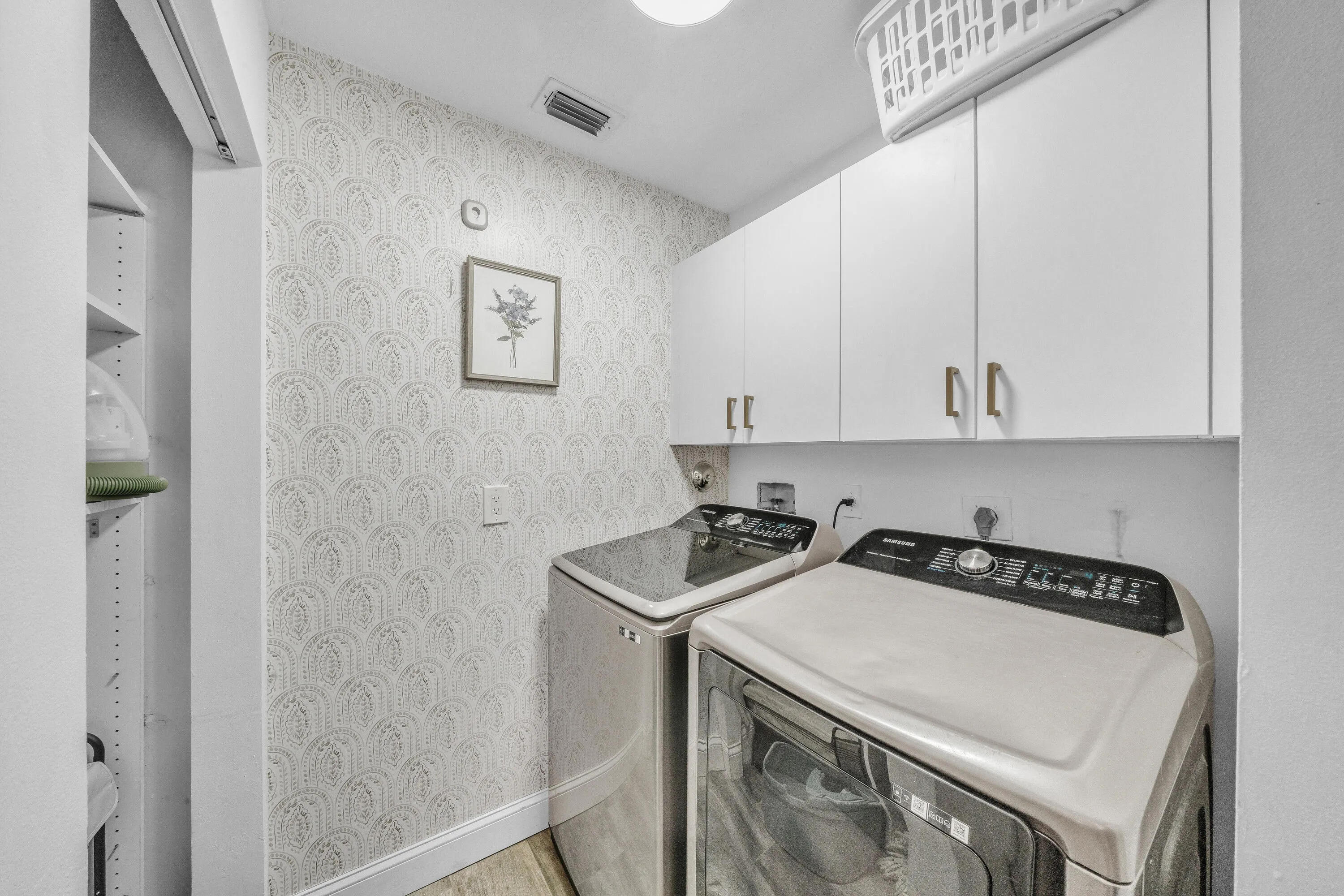 Dedicated Laundry Room with Built-In Cabinetry & Extra Storage