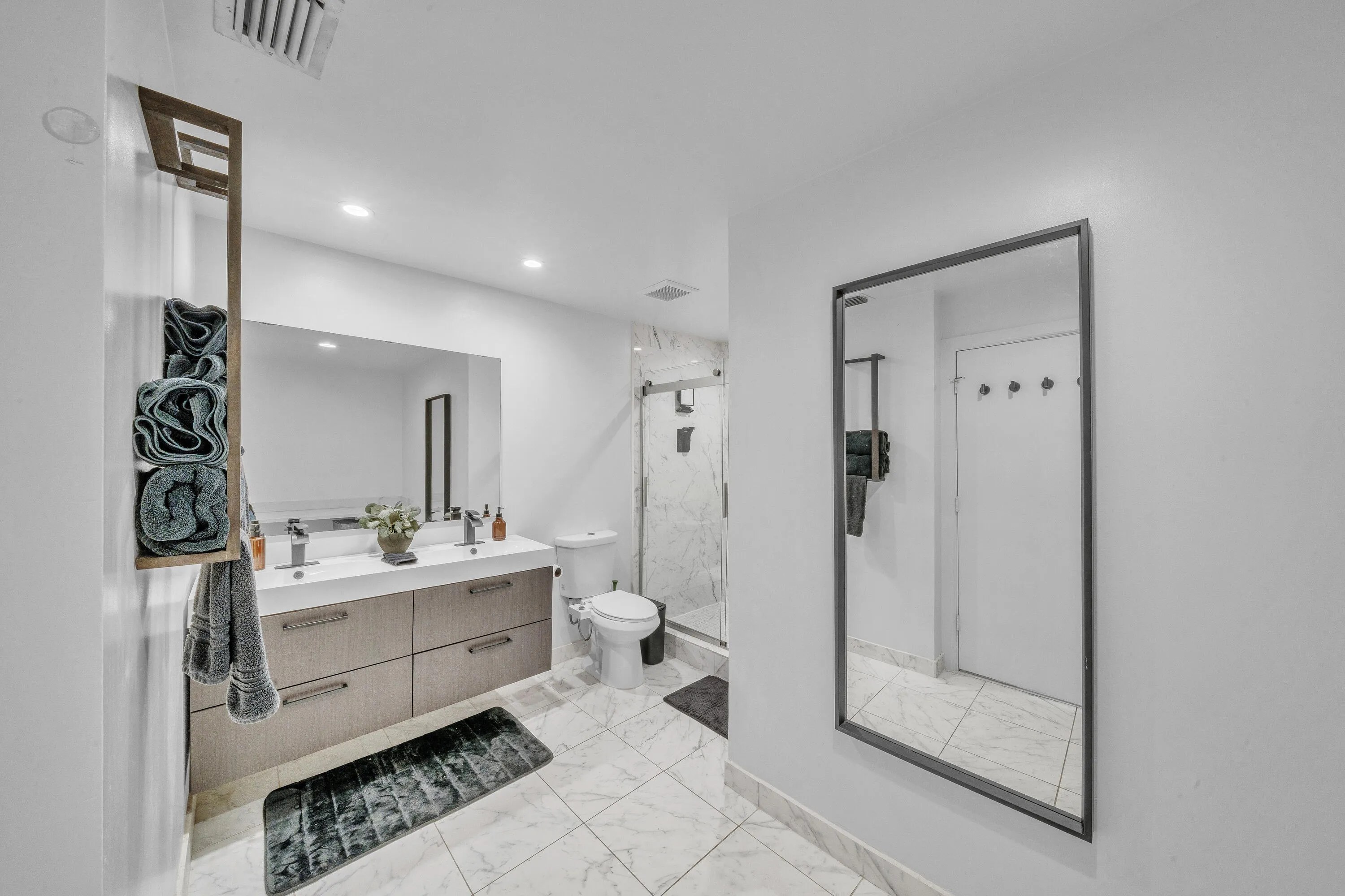 Spacious Primary Bathroom with Double Vanity and Walk-In Shower
