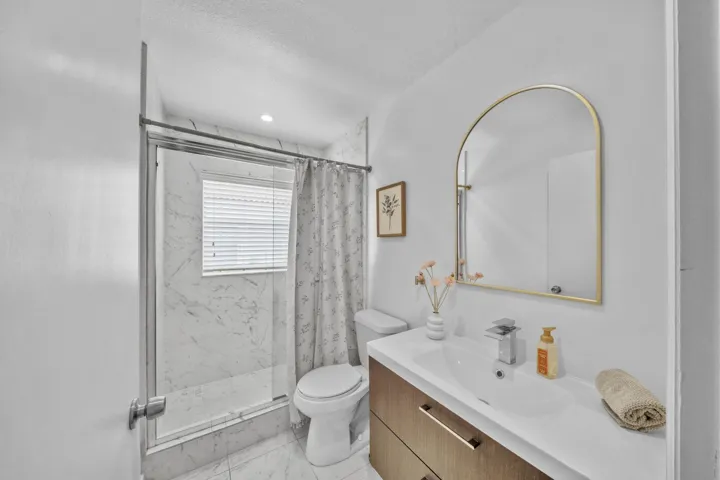 Glass Enclosed Shower & Updated Vanity
