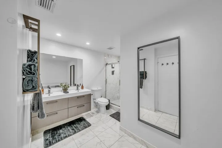 Spacious Primary Bathroom with Double Vanity and Walk-In Shower