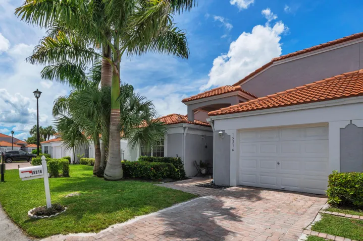 Front Exterior with Tile Roof and Driveway