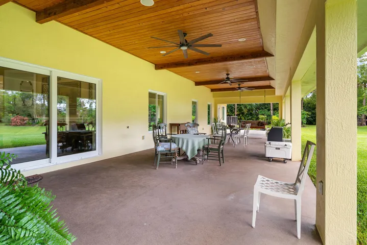 Lanai with custom wood beam ceiling