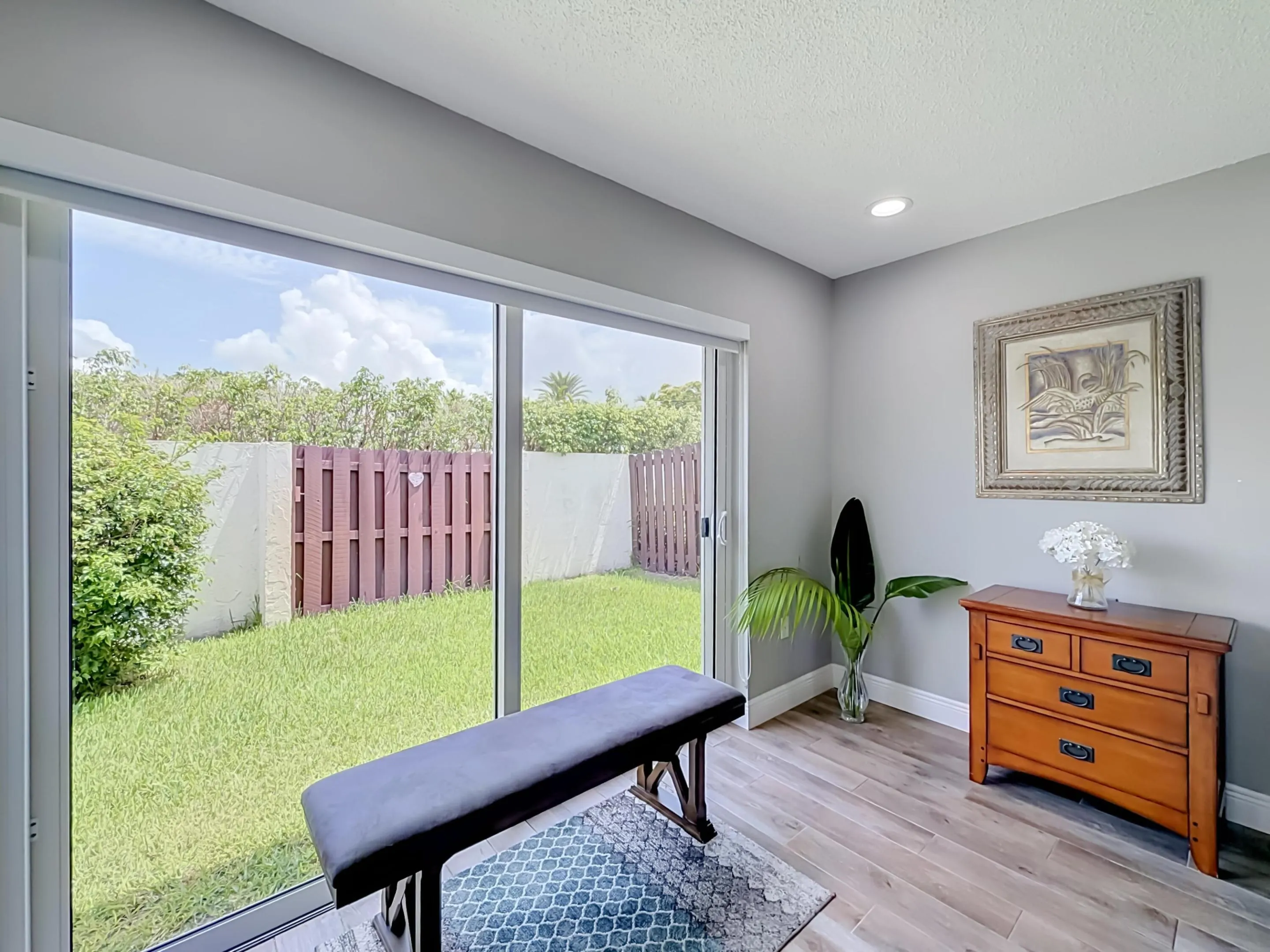 Primary sitting area with slider to backyard