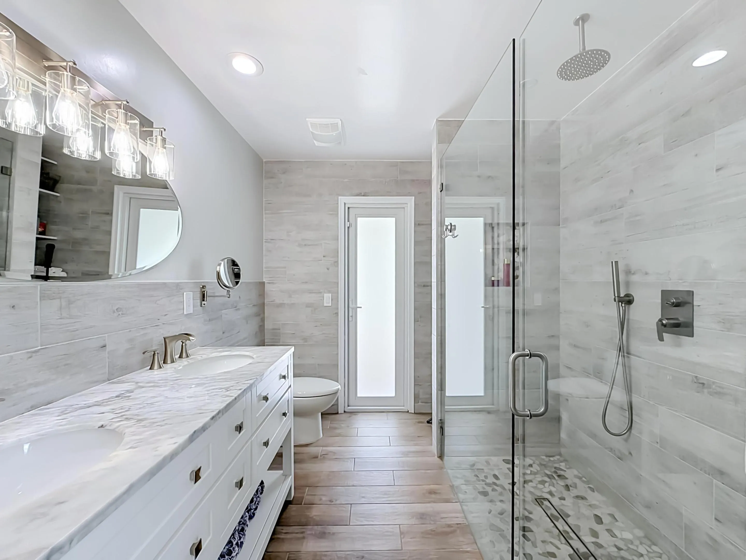 Primary Bathroom remodeled dual sink and shower, out to pool
