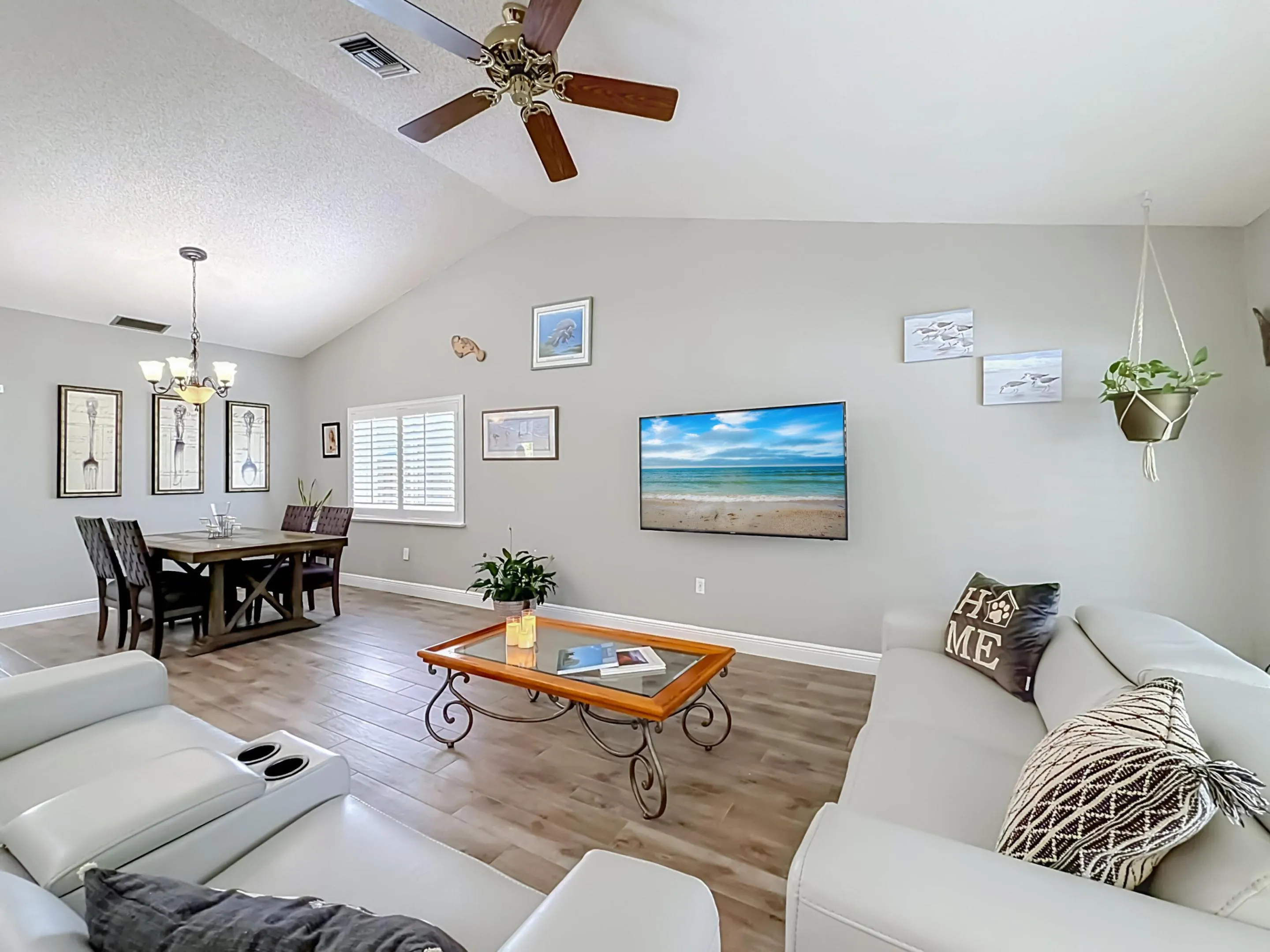 Vaulted Ceilings with fan in this Family/Living room dining room combo