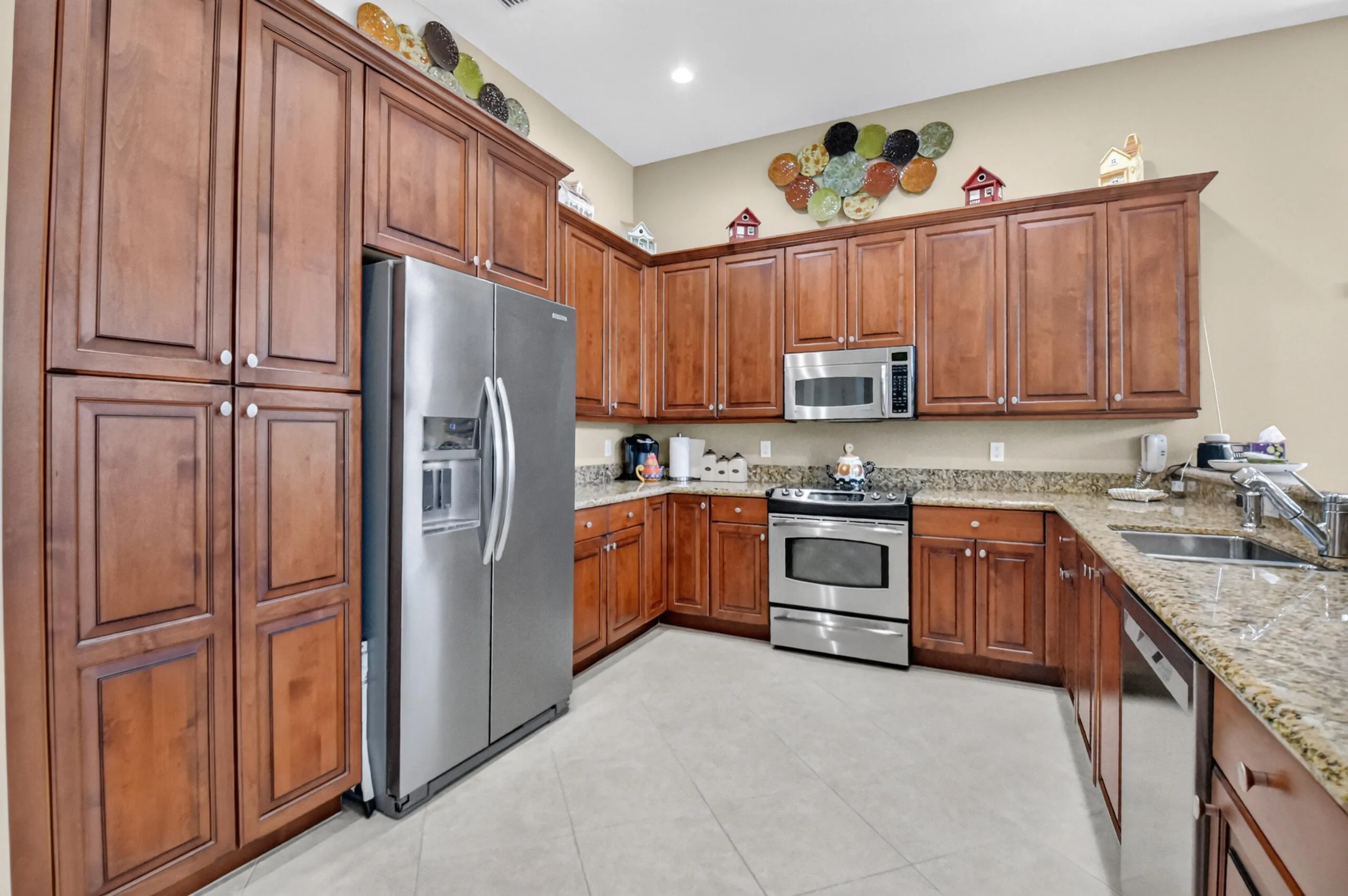 Rich wood cabinet doors & lovely granite counters