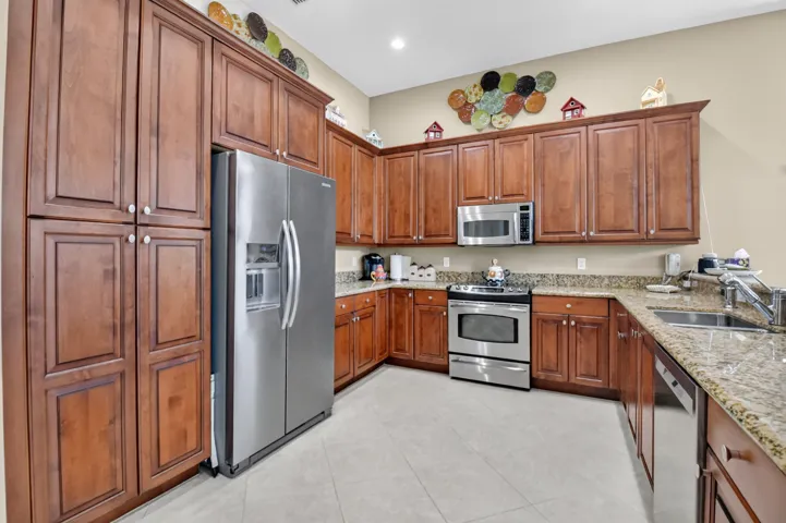 Rich wood cabinet doors & lovely granite counters