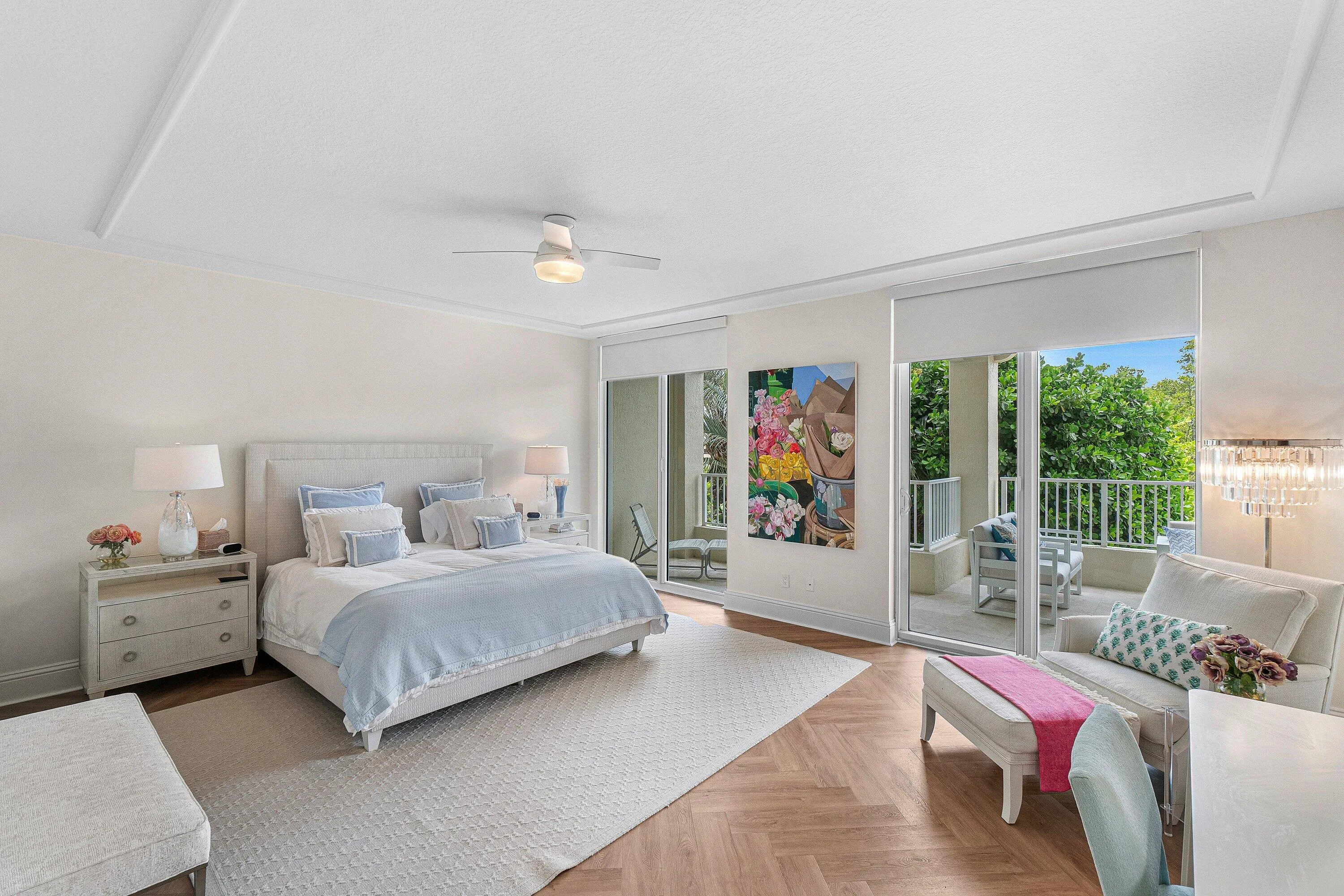 THE PRIMARY SUITE FEATURES A SITTING AREA AND BALCONY