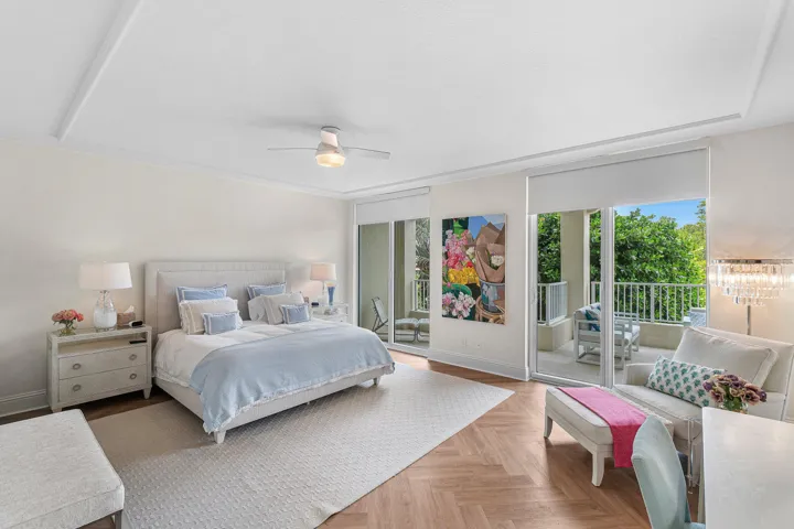 THE PRIMARY SUITE FEATURES A SITTING AREA AND BALCONY