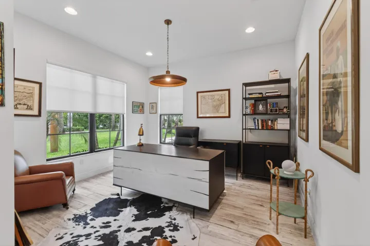 Spacious den/office filled with natural light, offering flexibility as a potential 4th bedroom.