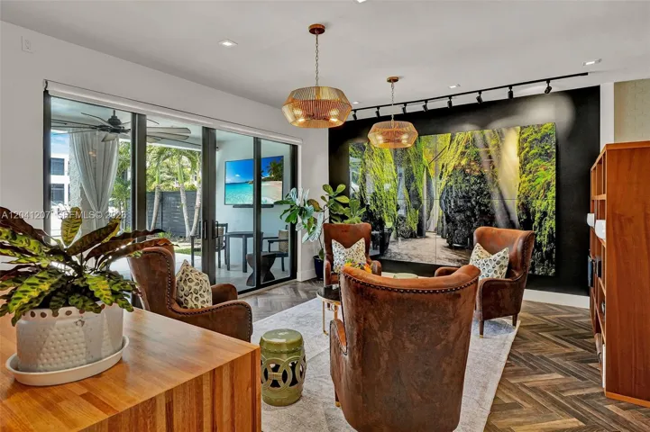 next to sliding glass doors to the pool and covered patio