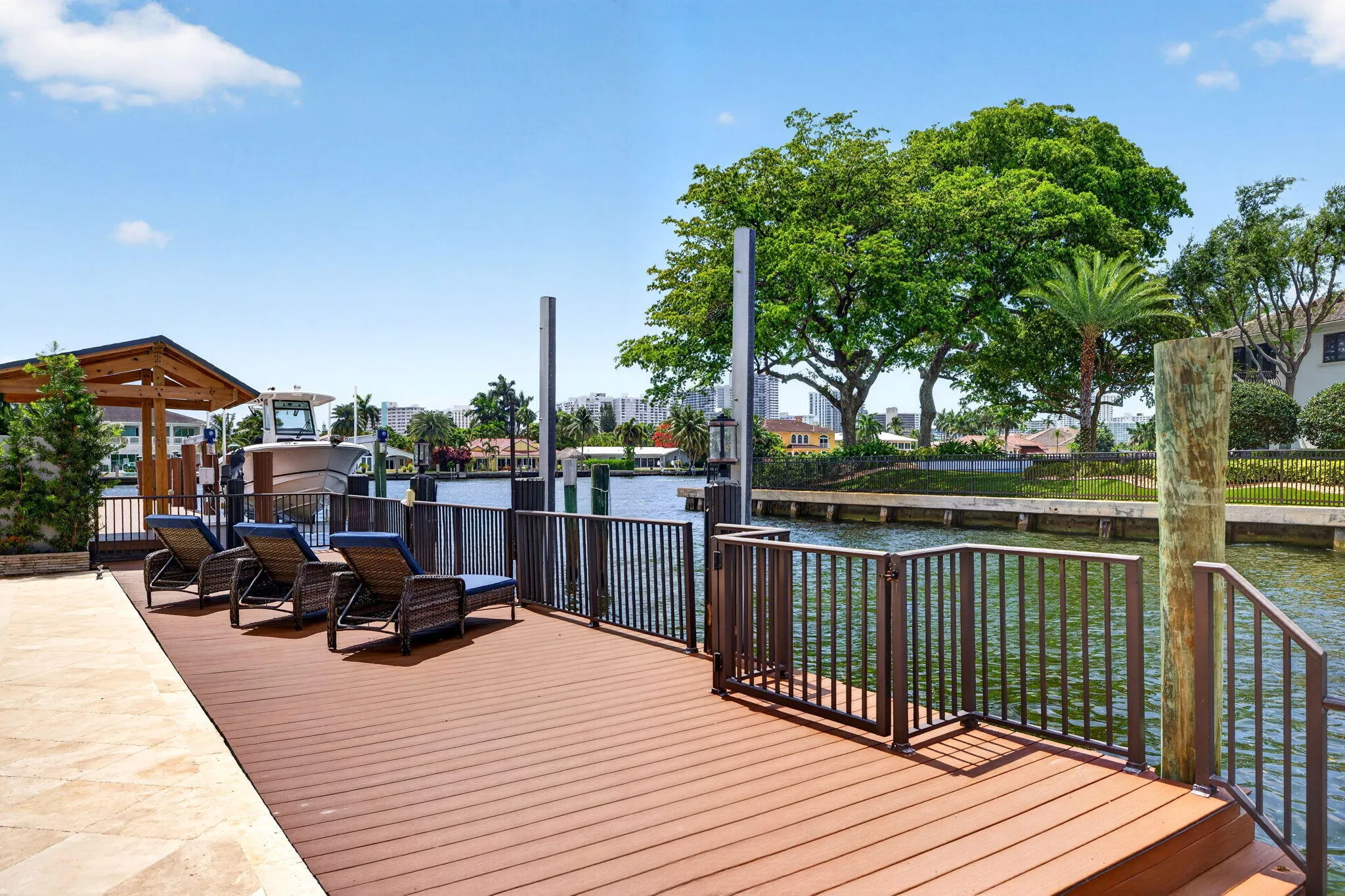 A dockside lounge area creates a relaxed place to enjoy the canal, breezes, and waterfront activity.