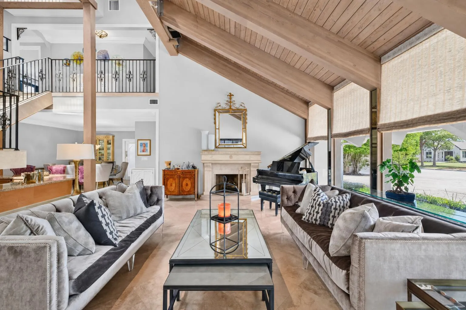 Expansive seating areas frame the home’s vaulted architecture and create a bright, comfortable main living space.