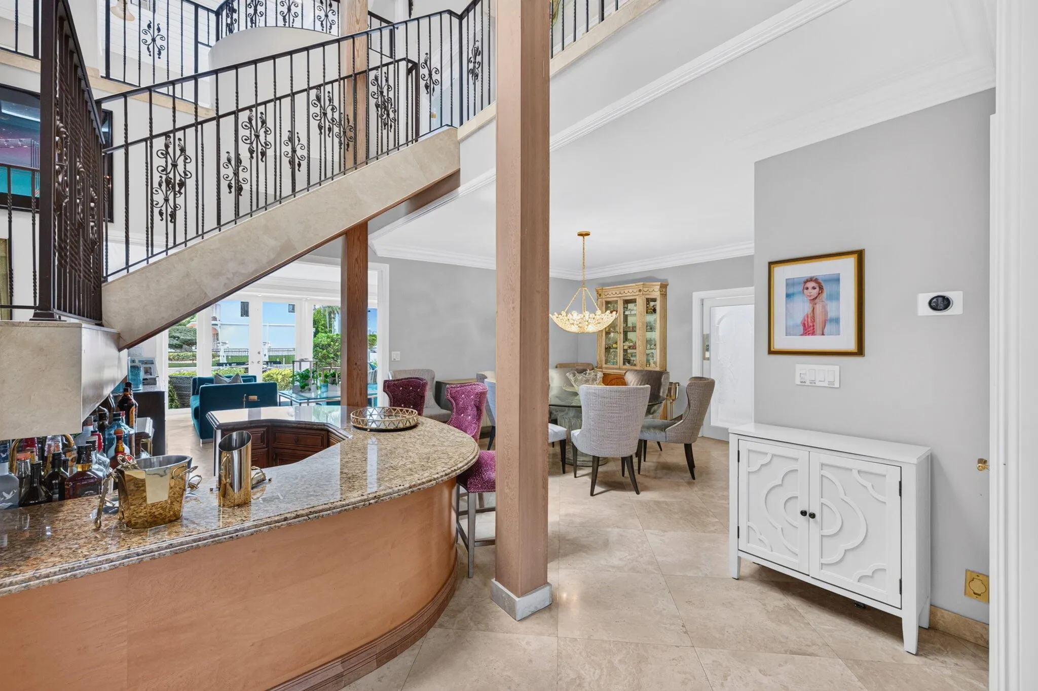 A convenient wet bar connects the entertaining spaces and supports effortless hosting between the living and dining areas.